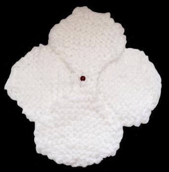 Hand knitted brooch in white with red pearl